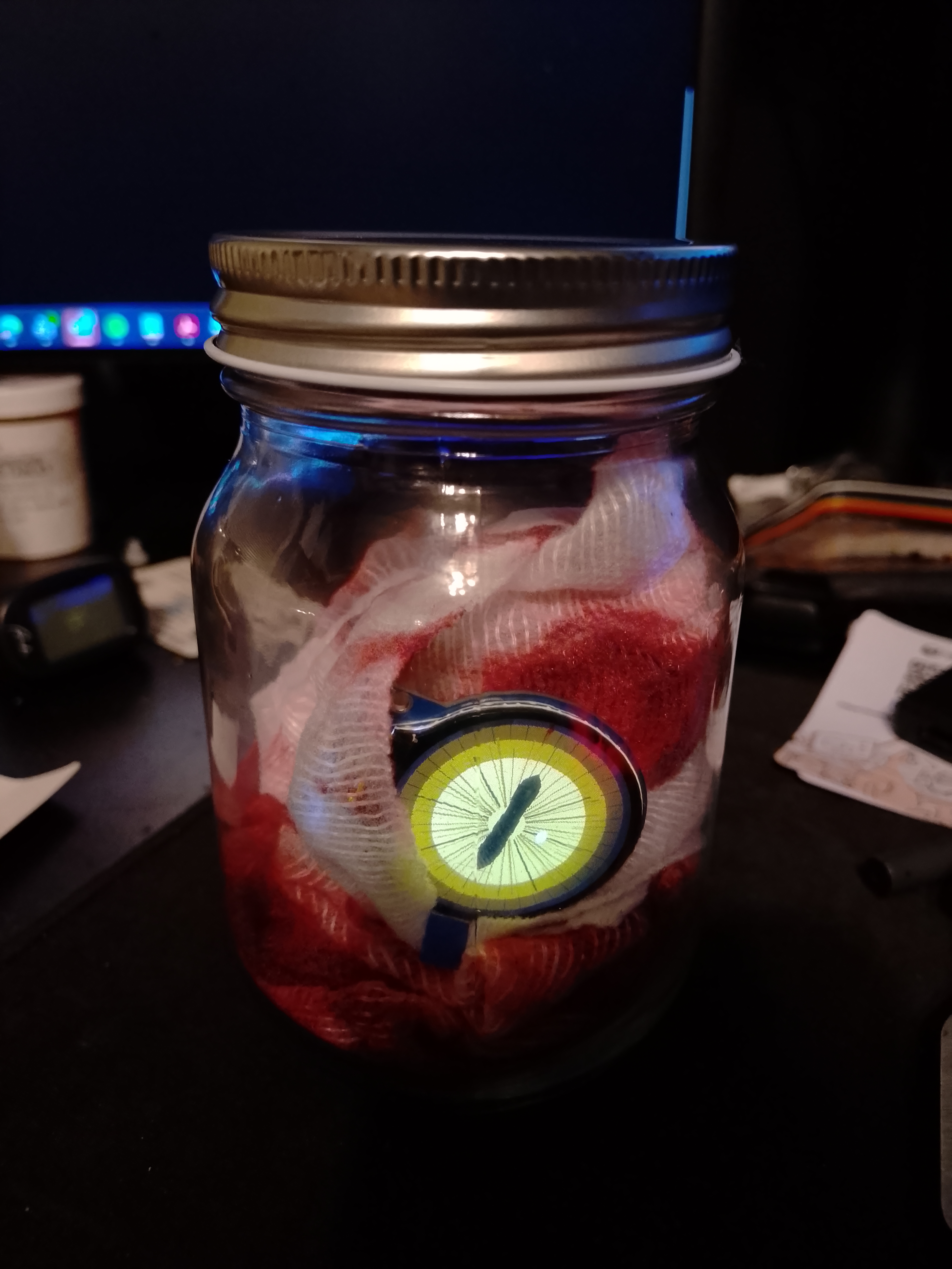 Yellow goat/slit pupil iris in a jar